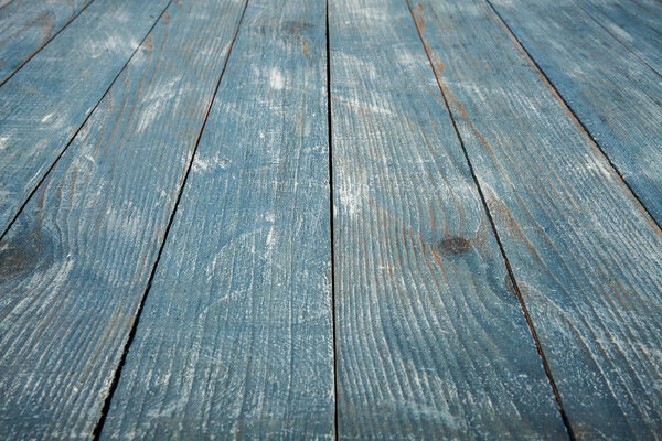 vintage blue wood background texture with knots and nail holes. Old painted wood. Blue abstract background.