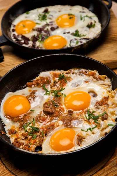 Fried eggs for breakfast. Pan of fried eggs with bacon. English breakfast