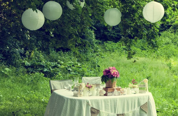 Wedding decoration in forest. Rustic wedding ceremony in forest. Vintage decoration in forest.