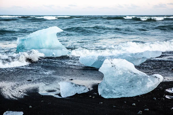 Diamond Beach Iceland. Ice on the black beach near Jokulsarlon glacier lagoon. Glacier icebergs in Iceland. Icelandic Nature.