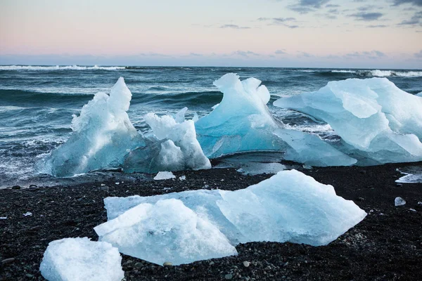 Diamond Beach Iceland. Ice on the black beach near Jokulsarlon glacier lagoon. Glacier icebergs in Iceland. Icelandic Nature.