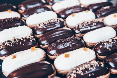 Traditional french eclairs with chocolate. Tasty dessert. Home made cake eclairs Sweet. Dessert. Pastry filled with cream. Chocolate icing.