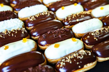 Traditional french eclairs with chocolate. Tasty dessert. Home made cake eclairs Sweet. Dessert. Pastry filled with cream. Chocolate icing.
