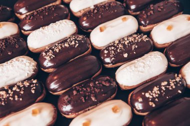 Traditional french eclairs with chocolate. Tasty dessert. Home made cake eclairs Sweet. Dessert. Pastry filled with cream. Chocolate icing.