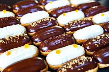 Traditional french eclairs with chocolate. Tasty dessert. Home made cake eclairs Sweet. Dessert. Pastry filled with cream. Chocolate icing.