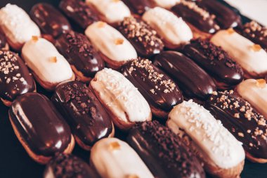 Traditional french eclairs with chocolate. Tasty dessert. Home made cake eclairs Sweet. Dessert. Pastry filled with cream. Chocolate icing.