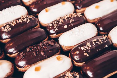Traditional french eclairs with chocolate. Tasty dessert. Home made cake eclairs Sweet. Dessert. Pastry filled with cream. Chocolate icing.