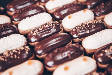 Traditional french eclairs with chocolate. Tasty dessert. Home made cake eclairs Sweet. Dessert. Pastry filled with cream. Chocolate icing.