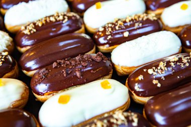 Traditional french eclairs with chocolate. Tasty dessert. Home made cake eclairs Sweet. Dessert. Pastry filled with cream. Chocolate icing.
