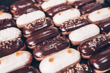 Traditional french eclairs with chocolate. Tasty dessert. Home made cake eclairs Sweet. Dessert. Pastry filled with cream. Chocolate icing.