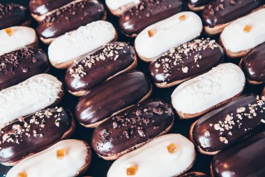 Traditional french eclairs with chocolate. Tasty dessert. Home made cake eclairs Sweet. Dessert. Pastry filled with cream. Chocolate icing.