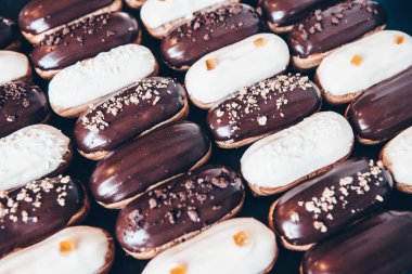 Traditional french eclairs with chocolate. Tasty dessert. Home made cake eclairs Sweet. Dessert. Pastry filled with cream. Chocolate icing.