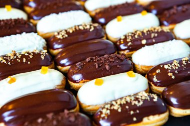 Traditional french eclairs with chocolate. Tasty dessert. Home made cake eclairs Sweet. Dessert. Pastry filled with cream. Chocolate icing.