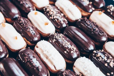 Traditional french eclairs with chocolate. Tasty dessert. Home made cake eclairs Sweet. Dessert. Pastry filled with cream. Chocolate icing.