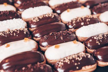 Traditional french eclairs with chocolate. Tasty dessert. Home made cake eclairs Sweet. Dessert. Pastry filled with cream. Chocolate icing.