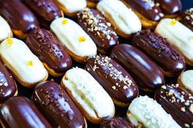Traditional french eclairs with chocolate. Tasty dessert. Home made cake eclairs Sweet. Dessert. Pastry filled with cream. Chocolate icing.