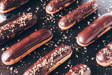 Traditional french eclairs with chocolate. Tasty dessert. Home made cake eclairs Sweet. Dessert. Pastry filled with cream. Chocolate icing.