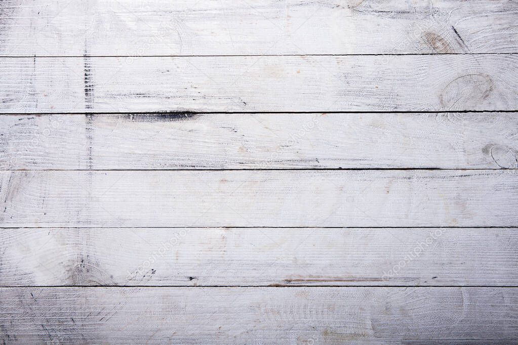 Vintage white wood background texture with knots and nail holes. Old painted wood wall. Brown abstract background. Vintage wooden light horizontal boards. Front view with copy space. Background for design.