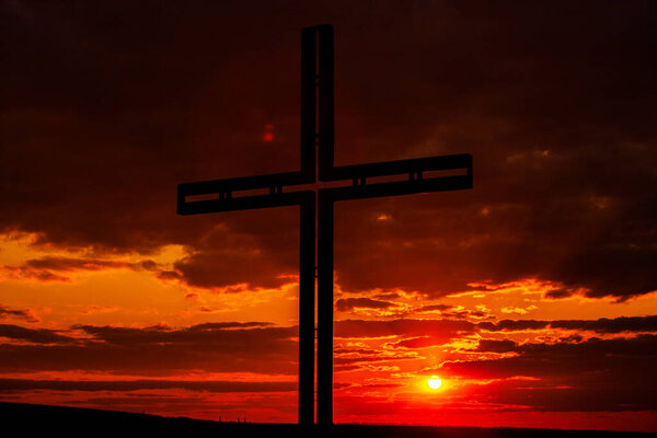 Crucifixion Of Jesus Christ - Cross At Sunset. Black cross religion symbol silhouette. Religious concept
