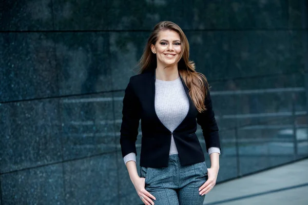 Confident business expert. Happy successful professional posing near office building. European girl. Russian business lady. Female business leader concept. Portrait Of Successful Business Woman