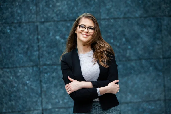 Confident business expert. Happy successful professional posing near office building. European girl. Russian business lady. Female business leader concept. Portrait Of Successful Business Woman