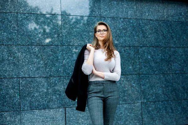 Confident business expert. Happy successful professional posing near office building. European girl. Russian business lady. Female business leader concept. Portrait Of Successful Business Woman