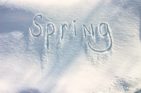 Spring - Snow Writing. Letters written on the snow surface. Frosty and sunny day — Stock Photo, Image