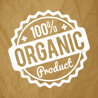 Organik ürün lastik damgası bir buruşuk kağıt kahverengi arka plan üzerinde beyaz.