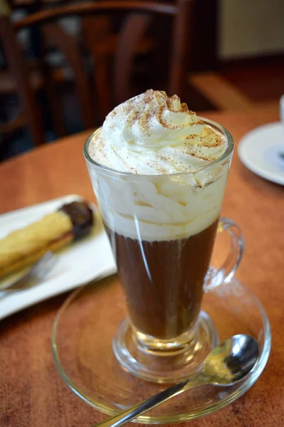 Viennese coffee with whipped cream on glass cup. — Stock Photo, Image