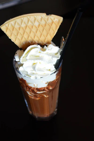 Chocolate milkshake drink with whipped cream on a glass — Stock Photo, Image