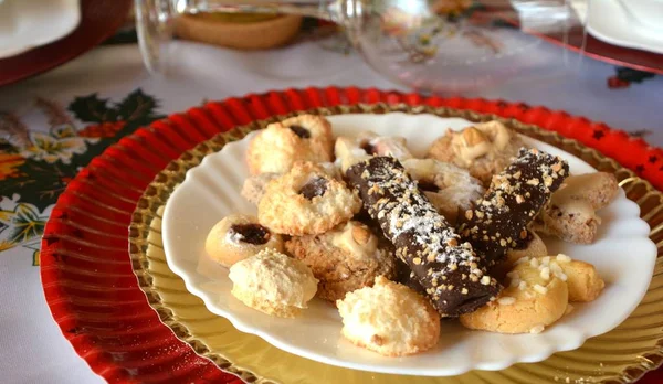 Christmas cookies on a plate on a decorated table. Dessert of cookies plate perfect for celebrating Christmas.