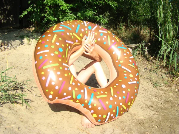 inflatable circle in the form of a doughnut for entertainment on the water