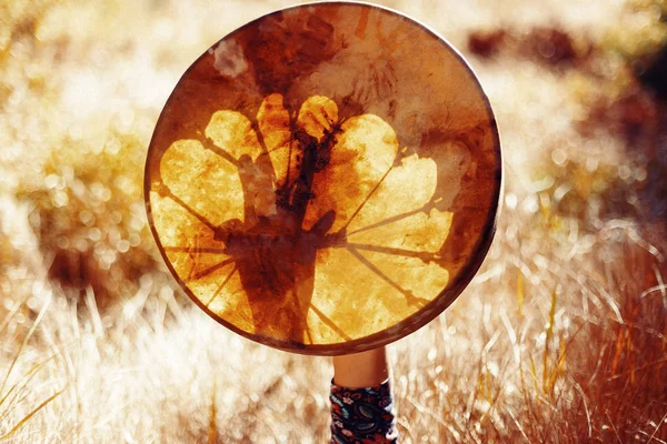 Shaman frame drum in woman hand in the nature. — Stock Photo, Image