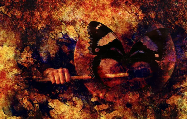 Schamanische Trommel in Frauenhand und Schmetterling. — Stockfoto