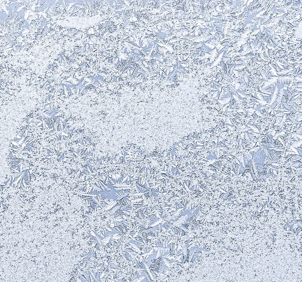 Frosty natural pattern on winter window, ornamental frost on the glass. — Stock Photo, Image