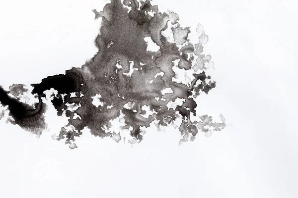 Salpicaduras negras abstractas sobre papel de acuarela blanco. imagen monocromática. — Foto de Stock