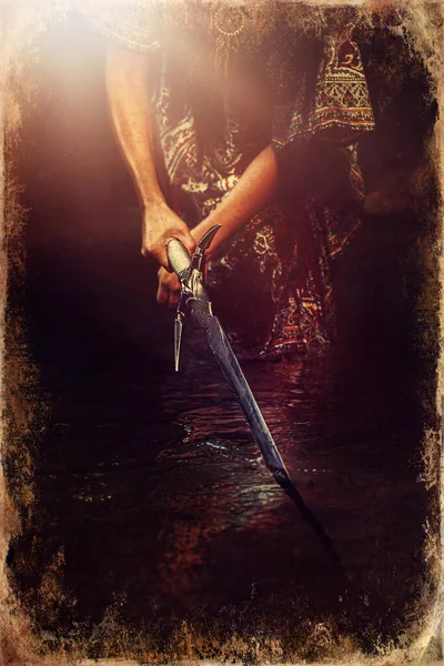 Woman with sword in lake, old photo effect. — Stock Photo, Image