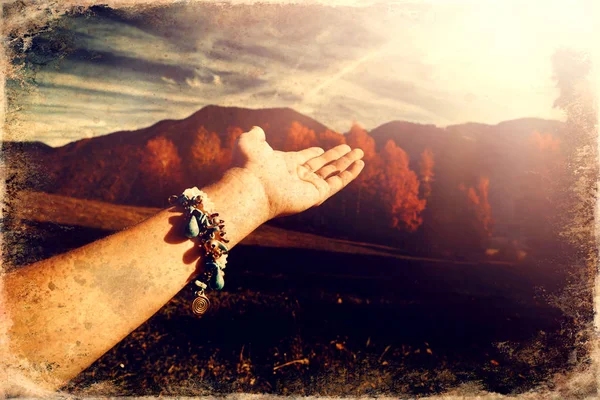 Beautiful landscape and woman hand with jewel. — Stock Photo, Image