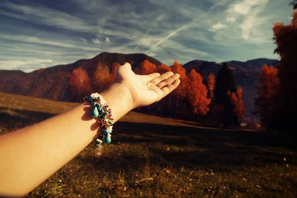 Beautiful landscape and woman hand with jewel. — Stock Photo, Image