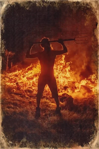 man with pitchfork by the fire, light graphic effect