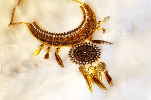 beautiful luxury jewel with filigrane ornaments lying on white fur