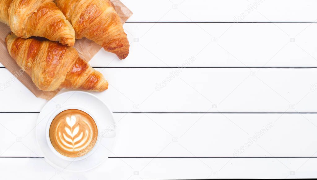 croissant coffee view from above white wooden background