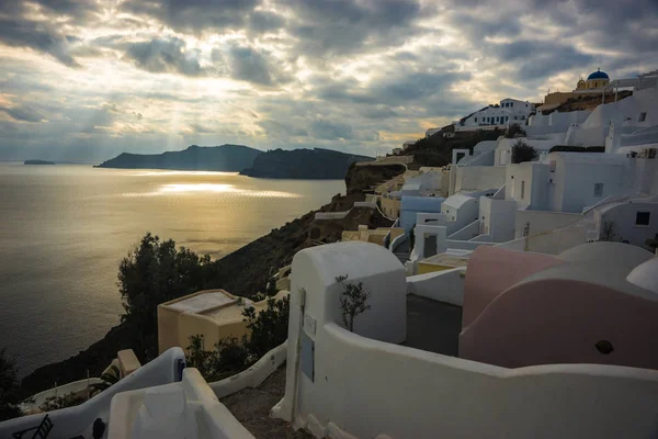 White city on a slope of a hill in Oia, Santorini, Greece