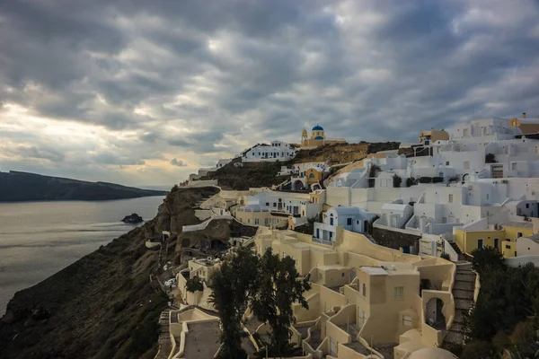 White city on a slope of a hill in Oia, Santorini, Greece