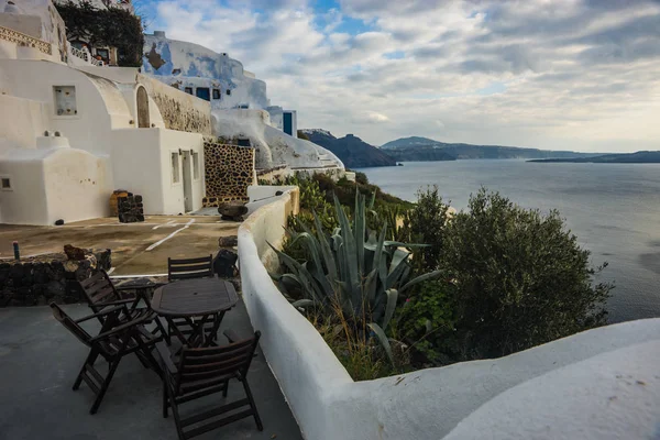 White city on a slope of a hill in Oia, Santorini, Greece