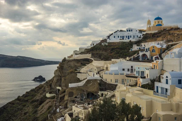 White city on a slope of a hill in Oia, Santorini, Greece