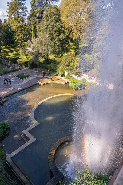 Sun flare and rainbow in the spray of the fountain of Villa d"Es — Stock Photo, Image
