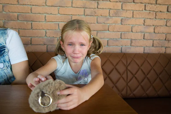 Little blond crying girl with sad expression and tears — Stock Photo, Image