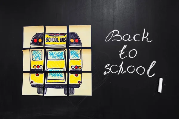 Back to school background with title "Back to school" and "school bus"  written on the yellow pieces of paper on the  chalkboard with title "Back to school"  written by chalk — Stock Photo, Image