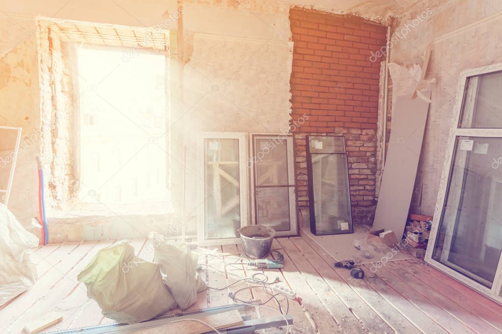 Working process of installing pvc windows in room of apartment is under construction, remodeling, renovation, extension, restoration and reconstruction